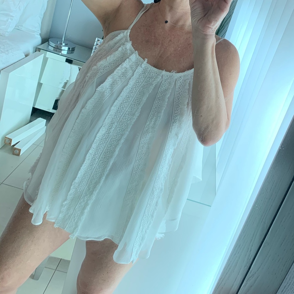 Ivory silk flowy top.